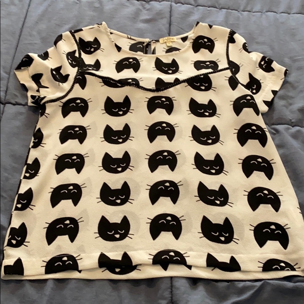 White with black cats shirt